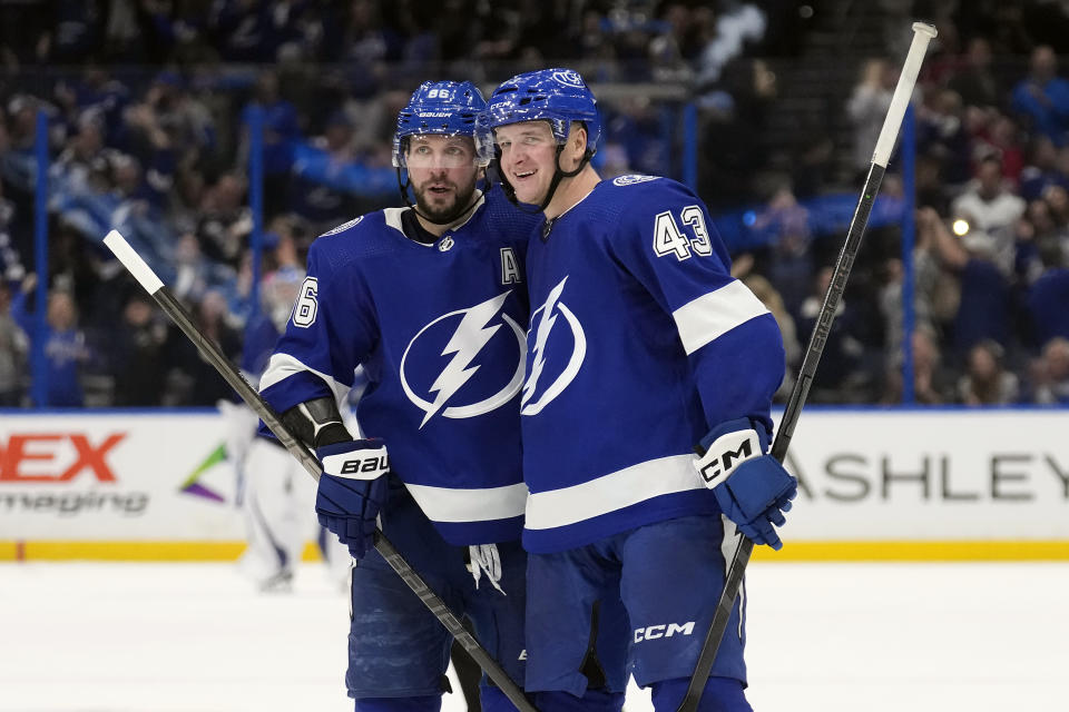 Tampa Bay Lightning defenseman Darren Raddysh (43) celebrates his game-winning goal against the New Jersey Devils with right wing Nikita Kucherov (86) during overtime in an NHL hockey game Thursday, Jan. 11, 2024, in Tampa, Fla. (AP Photo/Chris O'Meara)