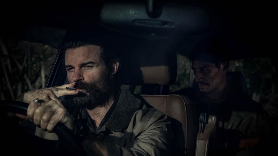 Daniel Gillies (left) and Matthias Luafutu play mysterious villains who kidnap a family in the New Zealand crime thriller "Coming Home in the Dark."