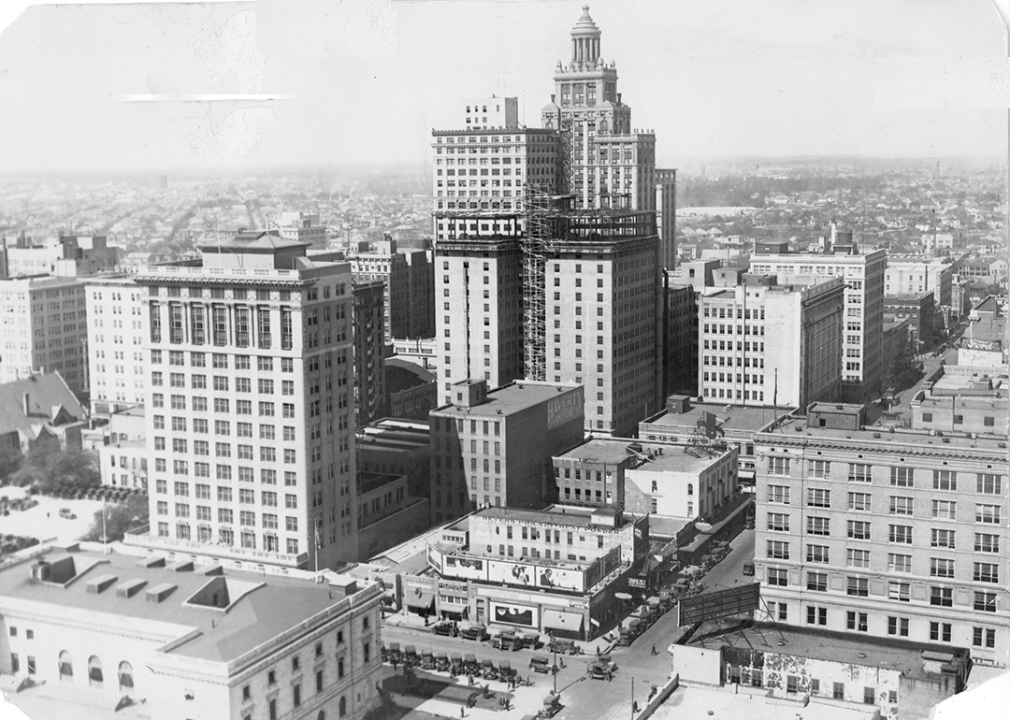 Downtown Houston skyline with Texas State Hotel under construction, Esperson Building in rear, Texaco Building at left.