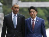 <p>President Barack Obama, left, talks with Japan’s Prime Minister Shinzo Abe on the Ujibashi bridge as they visit the Ise Jingu shrine in Ise, Mie prefecture, Japan Thursday, May 26, 2016 , ahead of the first session of the G-7 summit meetings. When Obama and Abe make a historic visit to Hiroshima – the first time a sitting U.S. president has visited the site of the first atomic bomb attack – their words advocating nuclear disarmament will clash with real-world security necessities. (Photo: Toru Hanai/Pool Photo via AP) </p>