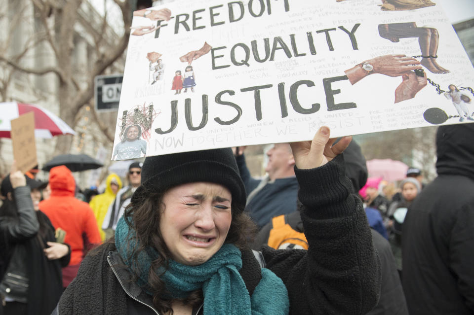 A woman cries during the Women's March in San Francisco on Jan. 21, 2017, after Trump's presidential inauguration.