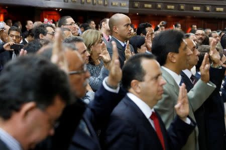 Hector Rodriguez (top C), newly elected governor of Miranda state, is sworn in to the National Constituent Assembly during a ceremony at Palacio Federal Legislativo, in Caracas, Venezuela October 18, 2017. REUTERS/Marco Bello