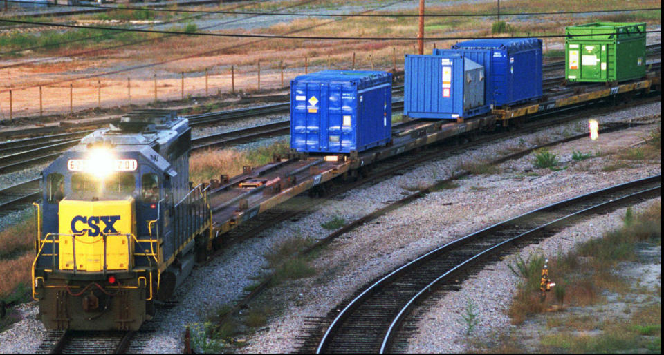 FILE - In this Sept. 29, 1994 file photo, a CSX Train with spent nuclear fuel passes through Florence, S.C., on its way to Savannah River Site Weapons Complex near Aiken S.C. Nevada and South Carolina were jostling for a home-field advantage of sorts in a federal court battle that could result in a metric ton of weapons-grade plutonium being stored 70 miles from Las Vegas. A federal appeals court has ruled against Nevada in a legal battle over the U.S. government's secret shipment of weapons-grade plutonium to a site near Las Vegas. A three-judge panel of the 9th U.S. Circuit Court of Appeals on Tuesday, Aug. 13, 2019, denied the state's appeal after a judge refused to block any future shipments to Nevada. The court in San Francisco says the matter is moot because the Energy Department already sent the radioactive material and has promised that no more will be hauled there. (Jeff Chatlosh/The Morning News via AP, File)