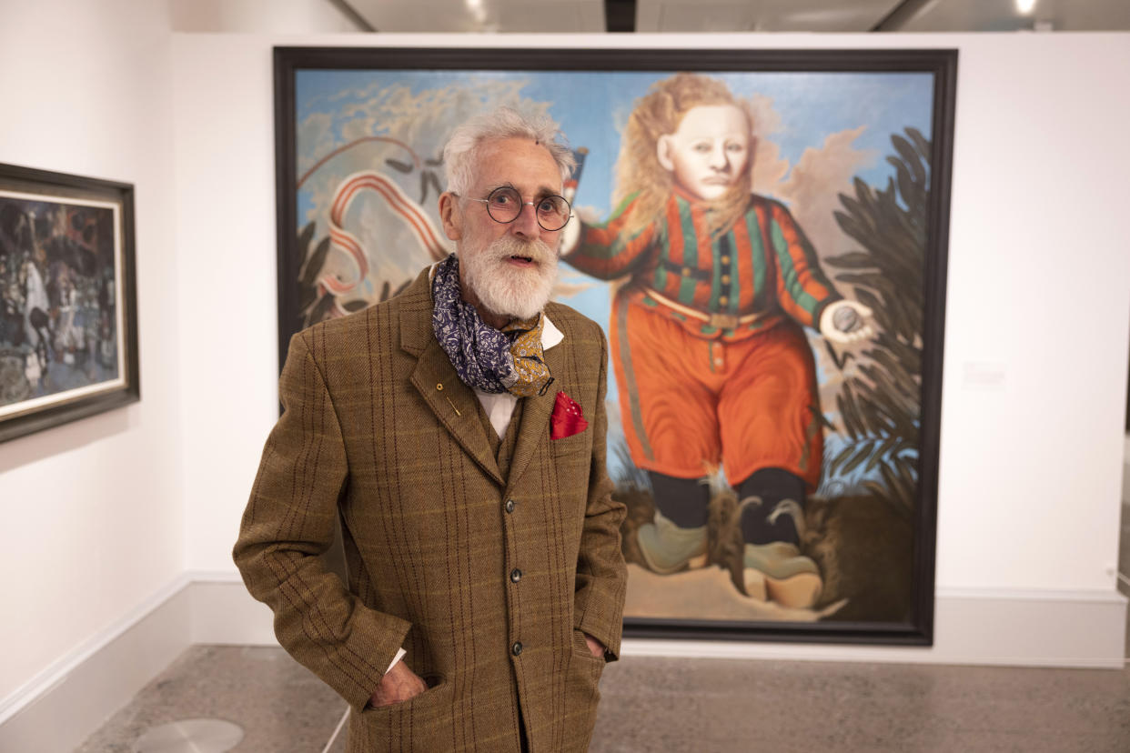 John Byrne poses with one of his artworks (Martin Shields/PA)