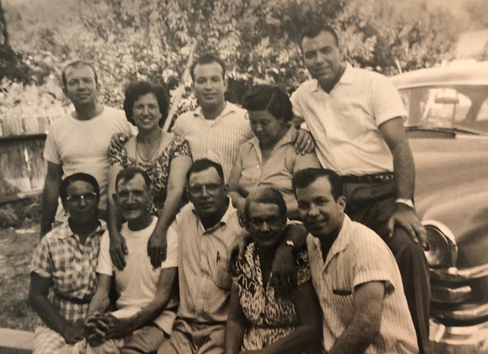 Throughout his life, Gonzalo Garza, upper right, was surrounded by family and friends. Here he is with family in San Antonio in the late 1950s. The decorated war veteran and career educator is remembered for his sense of humor and his devout Catholicism.