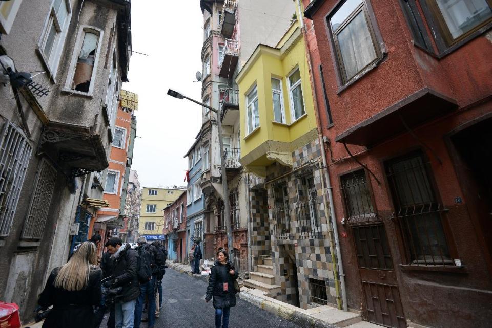 FILE - This Jan. 28, 2013 file photo shows a view of the street with the hostel, in yellow, where Sarai Sierra, a New York City woman was staying in Istanbul, Turkey. Sierra, a 33-year-old mother of two, went missing while vacationing alone in Istanbul. Her body was discovered Feb. 2 amid the ancient city walls in low-income district of Sarayburnu in Istanbul. Recent high-profile attacks on tourists in India, Brazil, Turkey and Mexico have raised questions about personal safety for overseas travel, especially for women. But frequent travelers and those who work in the industry say a few common-sense precautions can go a long way to ensuring personal safety. (AP Photo, file)