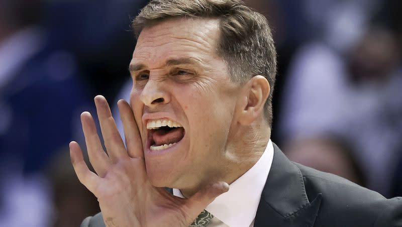 UVU Basketball Coach Mark Madsen screams plays during the game against BYU at BYU in Provo on Wednesday, Dec. 7, 2022.