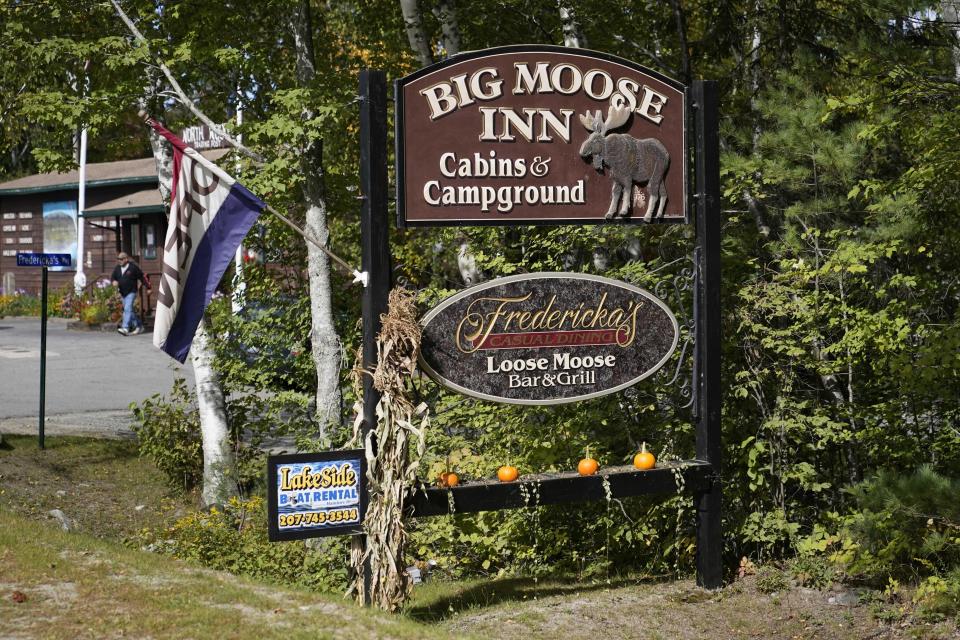 FILE—A sign for the Big Moose Inn is seen Friday, Sept. 18, 2020, near Millinocket, Maine. The inn was the setting for an Aug. 7 wedding reception that has since been linked to numerous cases of the coronavirus, and several deaths. Plans for a lawsuit against the Maine venue that hosted what became a "super spreader" wedding reception underscore the liability risks to small businesses amid the coronavirus pandemic and an uphill push by Republicans in Congress to give such outfits legal immunity. (AP Photo/Robert F. Bukaty, File)