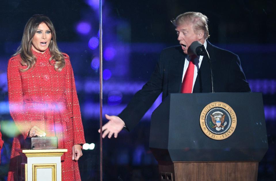 <p>President Donald Trump (R) gestures as first lady Melania Trump smiles during the 95th annual National Christmas Tree Lighting ceremony at the Ellipse in President’s Park near the White House in Washington on Nov. 30, 2017. (Photo: Jim Watson/AFP/Getty Images) </p>