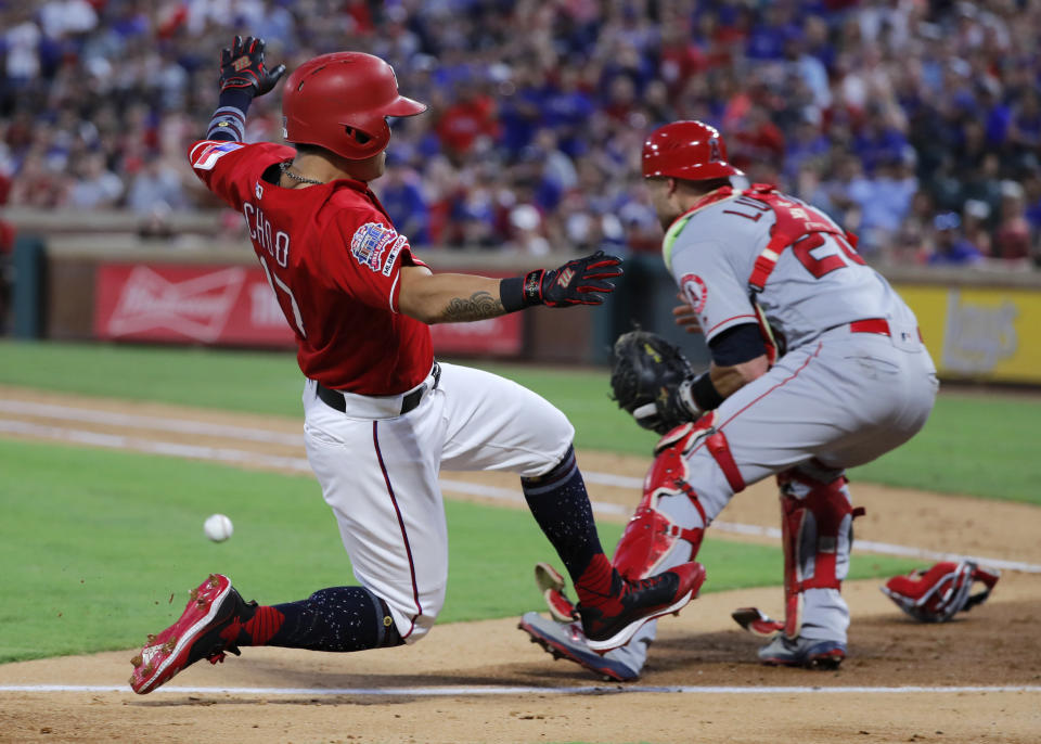 Texas Rangers' Shin-Soo Choo, left, slides ahead of the throw to Los Angeles Angels' Jonathan Lucro during the fourth inning of a baseball game in Arlington, Texas, Thursday, July 4, 2019. Choo scored on a single by Danny Santana. (AP Photo/Tony Gutierrez)