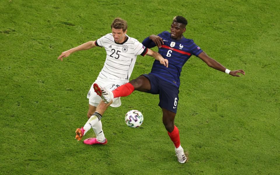 Thomas Muller and Paul Pogba battle for the ball - GETTY IMAGES