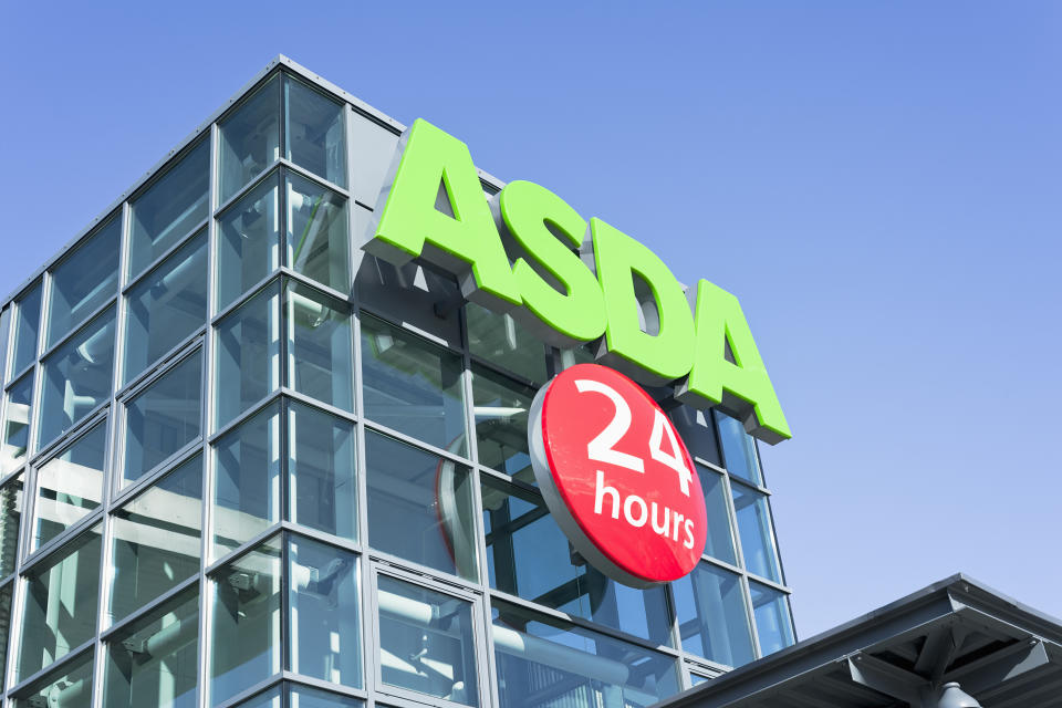 Edinburgh, Scotland, UK - 11th April 2011: An entrance sign on the exterior of a large Asda supermarket in Newhaven, Edinburgh.  Asda is a leading supermarket chain in the UK, and a subsidiary of Wal-Mart.