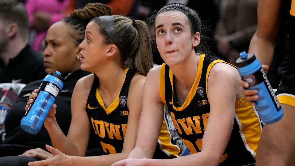 Iowa guard Caitlin Clark sits on the bench at the end of the game against South Carolina in the women's NCAA Tournament - Morry Gash/AP