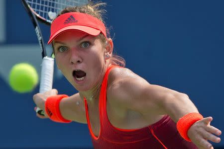 Simona Halep of Romania hits a return to Kateryna Bondarenko of Ukraine during their second round match at the U.S. Open Championships tennis tournament in New York, September 3, 2015. REUTERS/Carlo Allegri Picture Supplied by Action Images