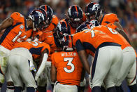 Denver Broncos quarterback Russell Wilson (3) huddles up his team during the second half of an NFL football game against the Indianapolis Colts, Thursday, Oct. 6, 2022, in Denver. (AP Photo/Jack Dempsey)