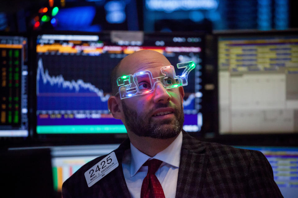 A trader wearing 2017 glasses works on the floor of the NYSE in New York, on Dec. 30, 2016. (Michael Nagle/Bloomberg)