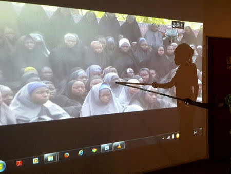 A student who escaped when Boko Haram rebels stormed a school and abducted schoolgirls, identifies her schoolmates from a video released by the Islamist rebel group at the Government House in Maiduguri, Borno State in this May 15, 2014 file photo. REUTERS/Stringer/Files
