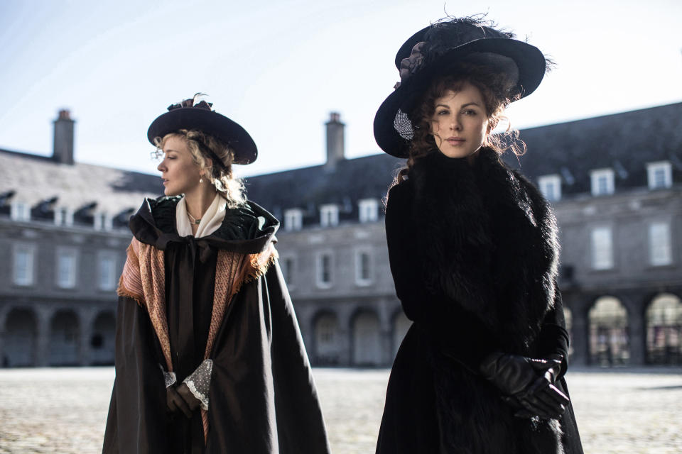 Chloë Sevigny and Kate Beckinsale stand in a courtyard