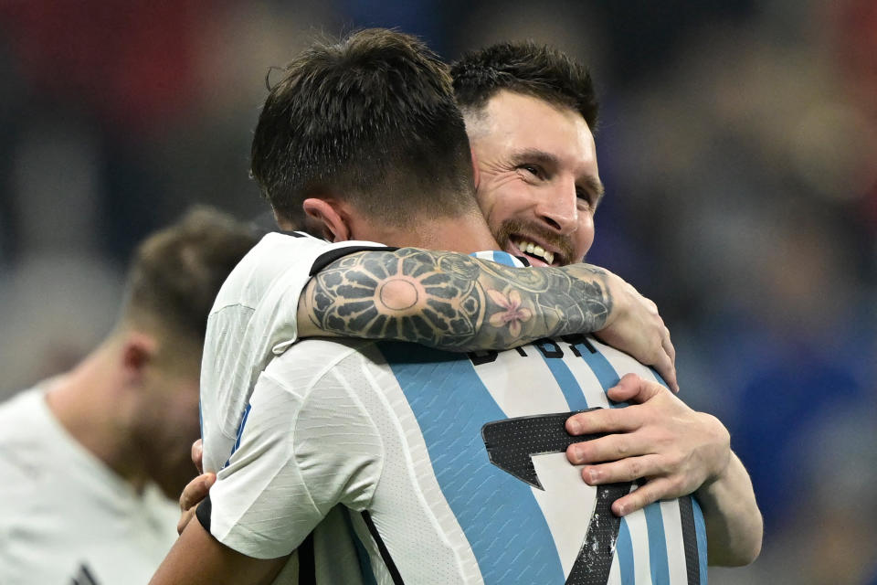 Argentina's forward #10 Lionel Messi celebrates with Argentina's forward #21 Paulo Dybala after defeating Croatia 3-0 in the Qatar 2022 World Cup football semi-final match between Argentina and Croatia at Lusail Stadium in Lusail, north of Doha on December 13, 2022. (Photo by JUAN MABROMATA / AFP) (Photo by JUAN MABROMATA/AFP via Getty Images)