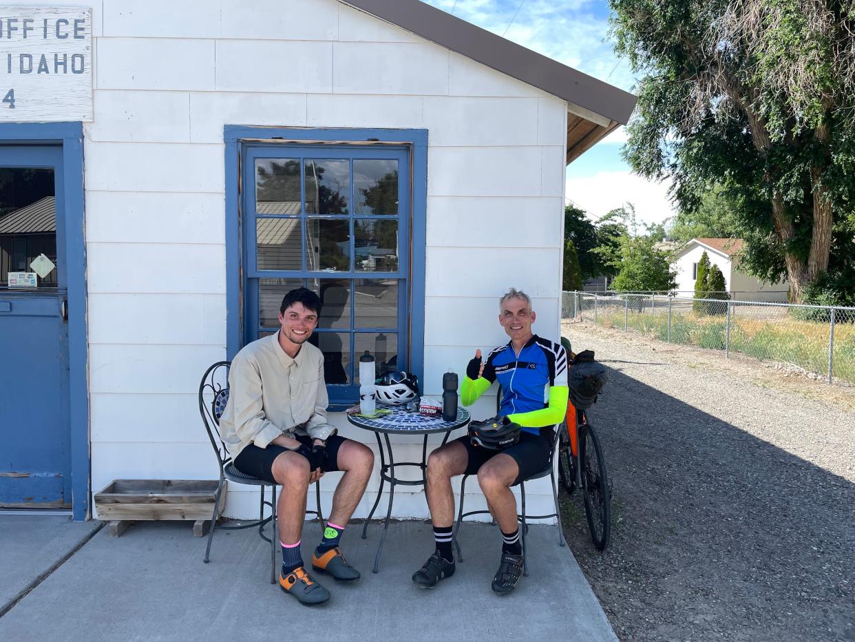 Sam and Chick Westby rest and hydrate at a post office in Idaho. The father-son duo from Wisconsin completed a 42-day, 3,600-mile cross-country bike trip on July 12, 2023.