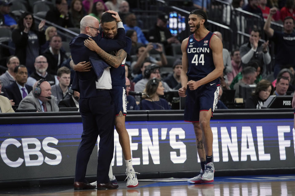 UConn head coach Dan Hurley celebrates with UConn guard Jordan Hawkins, middle, guard Andre Jackson Jr. (44) in the second half of an Elite 8 college basketball game against Gonzaga in the West Region final of the NCAA Tournament, Saturday, March 25, 2023, in Las Vegas. (AP Photo/John Locher)