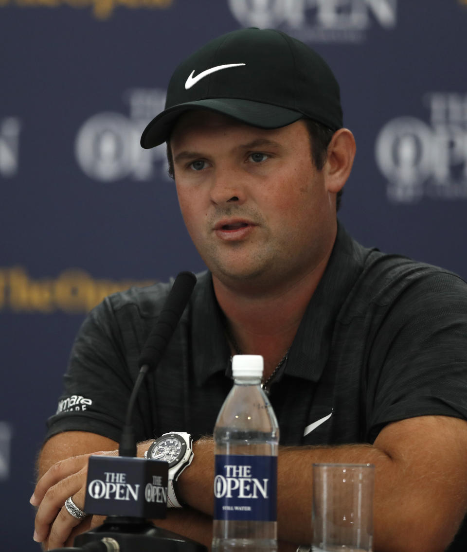 Patrick Reed of the United States answers a question at a press conference during at the 147th Open (AP Photo/Alastair Grant)