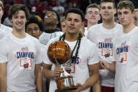 Wisconsin guard Johnny Davis (1) poses with the MVP trophy after an NCAA college basketball game against St. Mary's at the Maui Invitational in Las Vegas, Wednesday, Nov. 24, 2021. Wisconsin won 61-55. (AP Photo/Rick Scuteri)