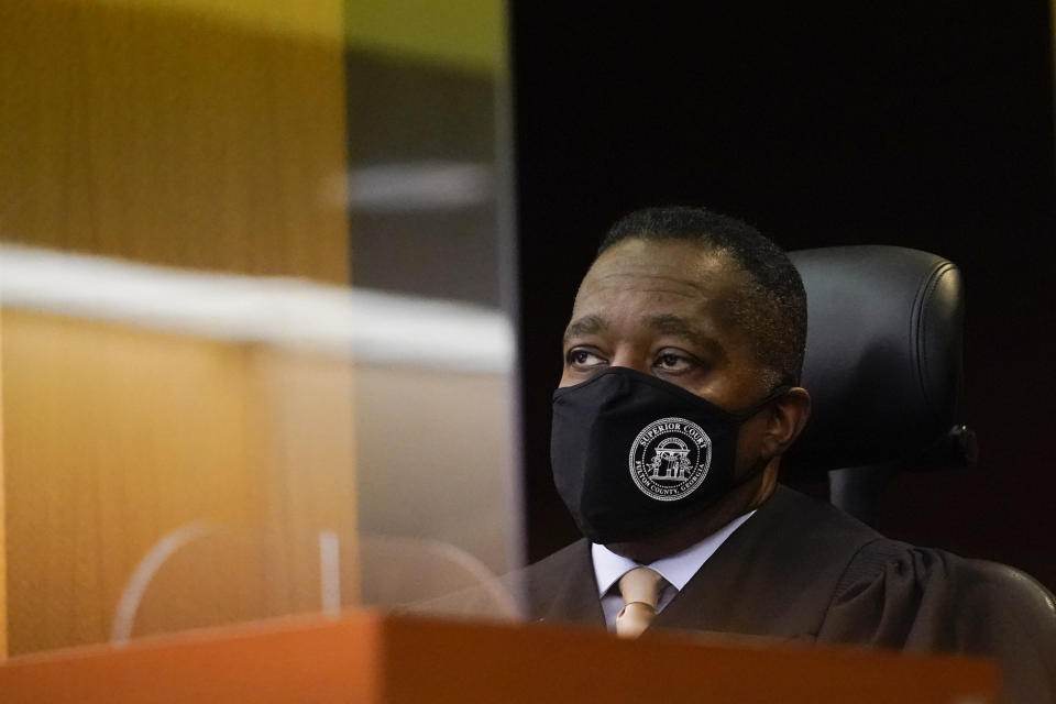 Judge Thomas A. Cox. Jr. listens to a plaintiff in a Fulton County Courthouse on Friday, Nov. 18, 2022, in Atlanta. A lawsuit was filed by the Democratic Party of Georgia, Democratic Senatorial Campaign Committee and the Warnock campaign that challenges guidance by Republican Secretary of State Brad Raffensperger, saying that it would be illegal to hold early voting on Saturday, Nov. 26, the day after a state holiday. (AP Photo/Brynn Anderson)