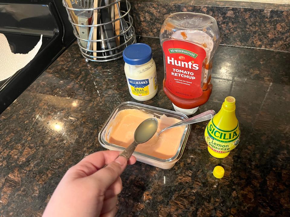 Lemon juice added to tomato and mayonnaise mixture