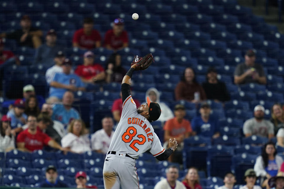 Baltimore Orioles third baseman Kelvin Gutierrez catches a foul out by Philadelphia Phillies' Odubel Herrera during the fifth inning of an interleague baseball game, Tuesday, Sept. 21, 2021, in Philadelphia. (AP Photo/Matt Slocum)