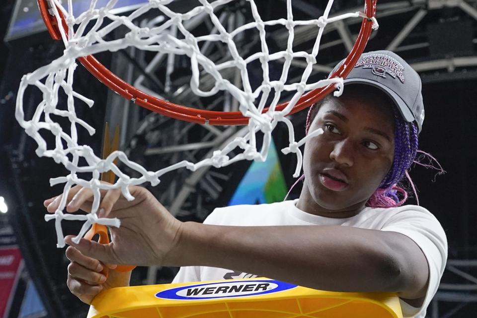 South Carolina's Aliyah Boston cuts the net after a college basketball game in the final round of the Women's Final Four NCAA tournament against UConn Sunday, April 3, 2022, in Minneapolis. South Carolina won 64-49 to win the championship. (AP Photo/Eric Gay)