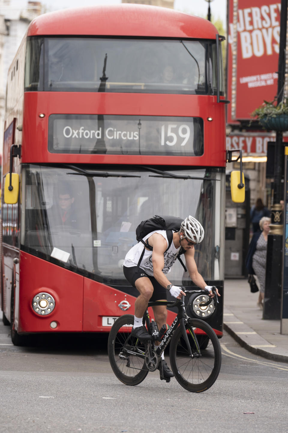 With parliament in the distance, a cyclist moves off from traffic lights in front of a 159 bus whose destination is Oxford Circus, on 19th April 2022, in London, England. (Photo by Richard Baker / In Pictures via Getty Images)