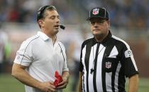 DETROIT, MI - NOVEMBER 22: Detroit Lions head coach Jim Schwartz (L) talks with NFL official Jerry Bergman during a disputed play during the game against the Houston Texans at Ford Field on November 22, 2012 in Detroit, Michigan. The Texans defeated the Lions 34-31. (Photo by Leon Halip/Getty Images)