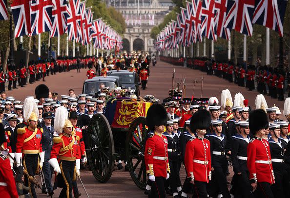 LONDON, ENGLAND - SEPTEMBER 19: The Queen's funeral cortege borne on the State Gun Carriage of the Royal Navy travels along The Mall on September 19, 2022 in London, England. Elizabeth Alexandra Mary Windsor was born in Bruton Street, Mayfair, London on 21 April 1926. She married Prince Philip in 1947 and ascended the throne of the United Kingdom and Commonwealth on 6 February 1952 after the death of her Father, King George VI. Queen Elizabeth II died at Balmoral Castle in Scotland on September 8, 2022, and is succeeded by her eldest son, King Charles III.  (Photo by Dan Kitwood/Getty Images)