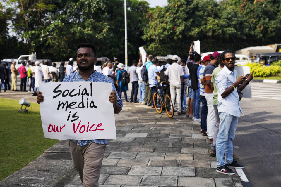 Sri Lankan social media activists hold placards with slogans against the proposed Online Safety Bill during a protest near the Parliament in Colombo, Sri Lanka, Tuesday, Jan. 23, 2024. (AP Photo/Eranga Jayawardena)