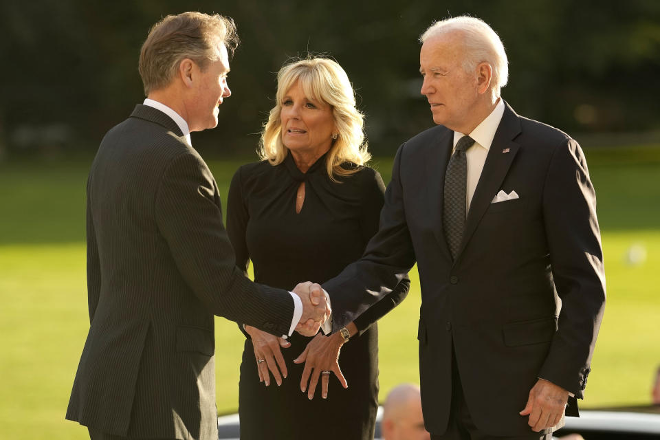 US President Joe Biden accompanied by First Lady Jill Biden are welcomed by Master of the Household Sir Tony Johnstone-Burt at Buckingham Palace in London, Sunday, Sept. 18, 2022. King Charles III is holding a reception at Buckingham Palace for heads of state and other leaders on Sunday evening ahead of the state funeral of Queen Elizabeth II on Monday. (AP Photo/Markus Schreiber, Pool)