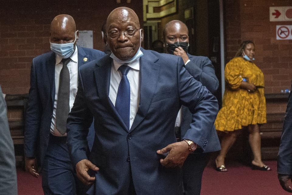 FILE - Former South African President Jacob Zuma enters the High Court following a recess in Pietermaritzburg, South Africa on Jan. 31, 2022. Former South African President Jacob Zuma has denounced the governing African National Congress party and announced that he will vote for a newly-formed political formation in the country’s general elections next year. (AP Photo/Jerome Delay, Pool, File)