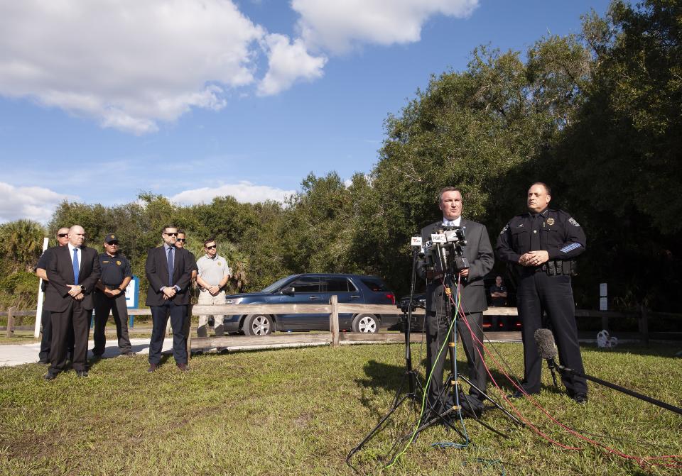 Special Agent in Charge Michael McPherson (center) of the FBI Tampa office announces that personal items belonging to Brian Laundrie have been found at the Myakkahatchee Creek Environmental Park on October 20, 2021, in North Port, Florida.