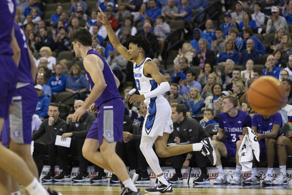 Creighton's Trey Alexander, right, reacts after hitting a 2-pointer against St. Thomas during the first half of an NCAA college basketball game Monday, Nov. 7, 2022, in Omaha, Neb. (AP Photo/Rebecca S. Gratz)