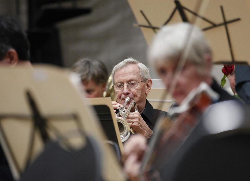 In this photo taken Monday, Sept. 24, 2012, Ron Hasselman, a retired trumpet player of the Musicians of the Minnesota Orchestra performs during the ACME Concert, a free event at the North Community YMCA, in Minneapolis. The Minnesota Orchestra was called the world's greatest not long ago, welcome recognition for musicians outside a top cultural center. Now its members are locked out of Orchestra Hall, stuck in the same kind of labor-management battle recently afflicting teachers and football referees. (AP Photo/Stacy Bengs)