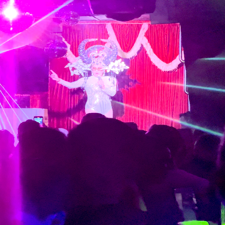 A drag queen performing