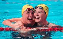 First-place Bronte celebrates with third-placed Cate after the women's 100m freestyle final at the 16th FINA World Championships in Kazan, Russia in 2015. Photo: Getty
