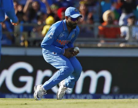 India's Ravindra Jadeja drops a catch off West Indies batsman Darren Sammy during their Cricket World Cup match in Perth, March 6, 2015. REUTERS/David Gray