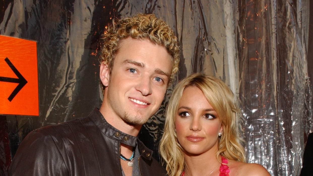 justin timberlake and britney spears arrive at the 29th annual american music awards january 9, 2002 at the shrine auditorium in los angeles photo by kmazurwireimage