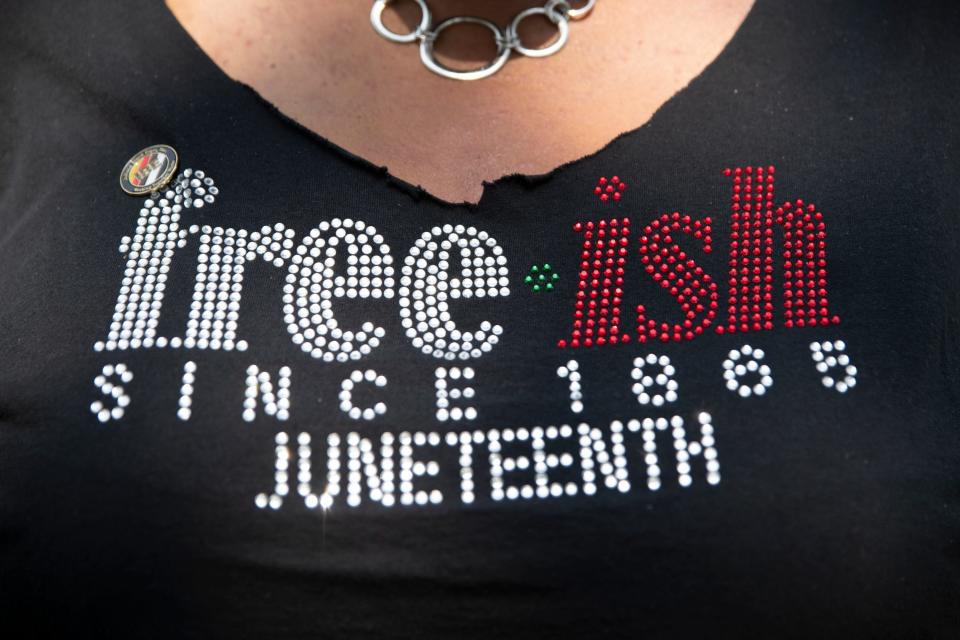 Latorya Greene wears a shirt that reads “Free-ish since 1865" at the Juneteenth celebration in LaSalle Park in South Bend on June 17, 2023.