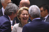 European Commission President Ursula von der Leyen, center, speaks with European Parliament President David Sassoli, left, and Portuguese Prime Minister Antonio Costa during a round table meeting at an EU summit in Brussels, Thursday, Feb. 20, 2020. After almost two years of sparring, the EU will be discussing the bloc's budget to work out Europe's spending plans for the next seven years. (AP Photo/Olivier Matthys)