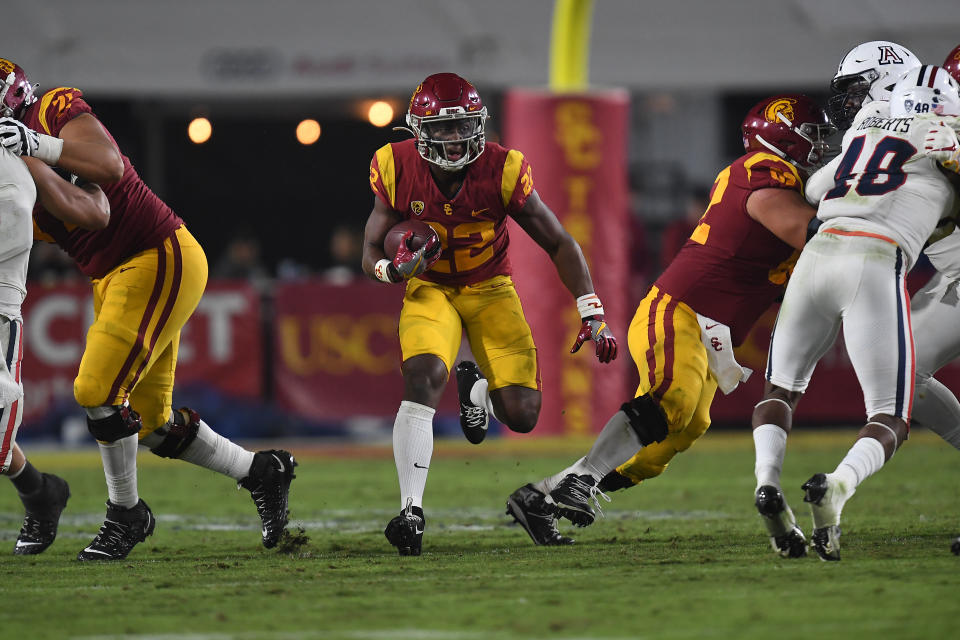 Oct 30, 2021; Los Angeles, California, USA; Southern California Trojans running back Darwin Barlow (22) runs the ball against the Arizona Wildcats during the second half at United Airlines Field at Los Angeles Memorial Coliseum. Mandatory Credit: Gary A. Vasquez-USA TODAY Sports