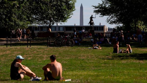 PHOTO: People relax at Meridian Hill Park on a summer day, with the Washington Monument in the distance, Aug. 11, 2019, in Washington, D.C. (Alastair Pike/AFP via Getty Images, FILE)