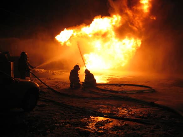 A file photo of a fire destroying a business in Davidson, Sask., in 2013. (Craik RCMP - image credit)