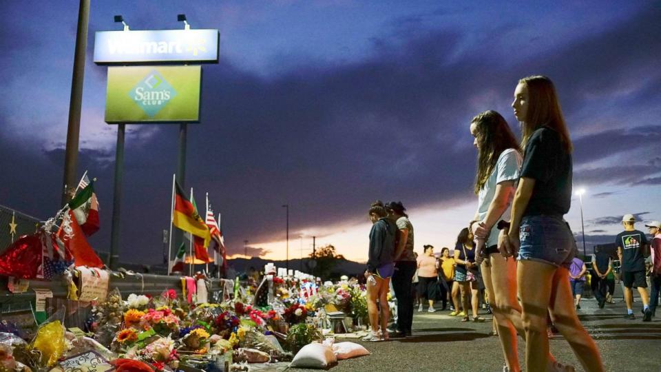 PHOTO: People gather at a makeshift memorial honoring victims outside Walmart in El Paso, Texas, Aug. 15, 2022. (Sandy Huffaker/Getty Images, FILE)